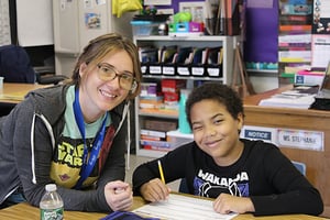 Teacher smiling with student 4