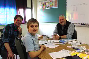 Teachers and student smiling